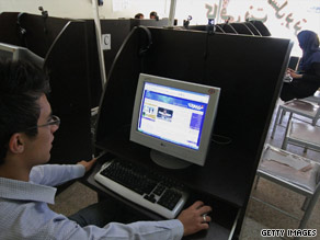 An Iranian youth reads a political blog in an Internet cafe.