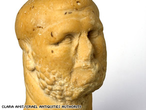 http://i2.cdn.turner.com/cnn/2009/TECH/science/01/26/israel.ancient.find/art.figurine.iaa.jpg