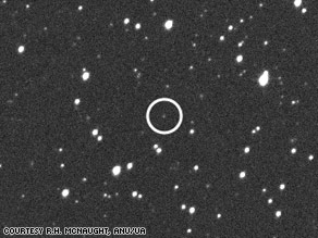 An asteroid (inside circle) passed within 38,000 miles of Earth on Monday.
