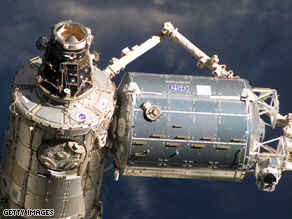 NASA says debris may threaten the International Space Station, seen here from Atlantis in February 2008.
