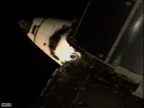 The orbiter Discovery docked with the international space station at 5:21 p.m. ET Tuesday, NASA said.