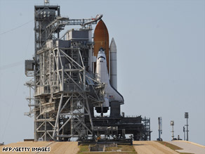 The space shuttle Atlantis is prepared for launch Sunday at the Kennedy Space Center in Florida.