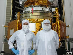 Dan Andrews, LCROSS manager (left) and Craig Tooley, LRO manager stand in front of the spacecraft. (NASA)