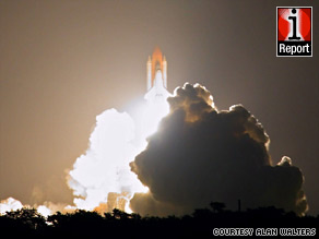 Space shuttle Discovery lifts off late Friday from Kennedy Space Center in a photo from iReporter Alan Walters.