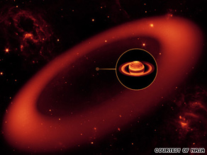 NASA's Spitzer Space Telescope has spotted a massive, nearly invisible ring around Saturn.