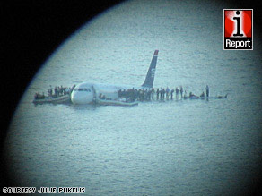 iReporter Julie Pukelis used a camera and telescope to get this view of the crash scene in the Hudson River.