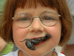 Unusual food festivals include BugFest in Raleigh, North Carolina, where a young visitor tries a stir-fried scorpion.