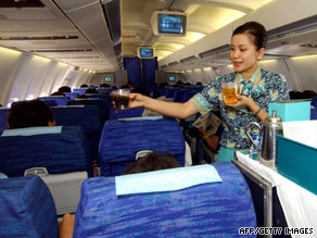 The job was once considered glamorous. Here, a flight attendant serves champagne aboard a jumbo jet in 1970.