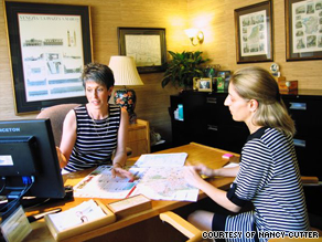 Nancy Cutter, a travel agent in Charlotte, North Carolina, discusses vacation options with a client.