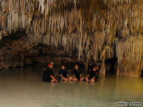 Stalactites hang overhead in a cave along Mexico's Riviera Maya.