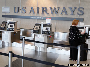 A US Airways passenger's first checked bag will cost $20 if prepaid online.