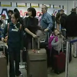 Stuck travelers endure airport misery