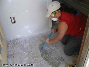 University of Illinois senior Adriana Collazo removes tile from the floor of a home in Pascagoula, Mississippi.
