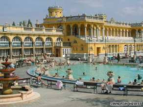 Locals in Budapest love to soak in their hot springs while playing chess.