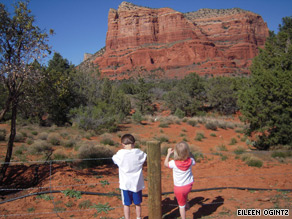 Ethan Sitzman, 7, and his 4-year-old sister Hannah stretch their legs on the long trip from the Grand Canyon to Scottsdale, Arizona.