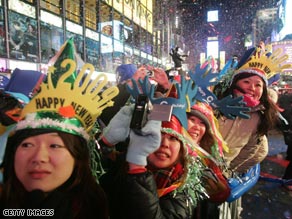 Revelers in New York braved freezing conditions and snow to see in the New Year.