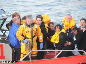 Passenger Jeff Kolodjay speaks to reporters after escaping from the downed plane.