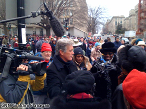 John Roberts speaks with a crowd on Sunday.