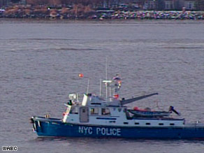 A New York Police boat in the Hudson waters Wednesday where divers found one of the plane's engines.