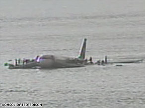 Surveillance video shows passengers of US Airways Flight 1549 hurrying onto the plane's wings last week.