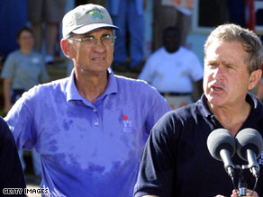 Millard Fuller appears with President Bush at a Habitat for Humanity event in Tampa, Florida, in 2001.