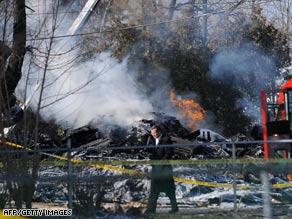 An investigator works the scene of the plane crash Friday outside Buffalo, New York.