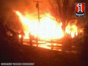 Bright flames obscured everything around the crash site, as iReporter Valerie Woodruff's photo shows.