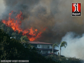 The U.S. Forest Service and state and city fire units plot strategy to handle the wildfire late Wednesday.