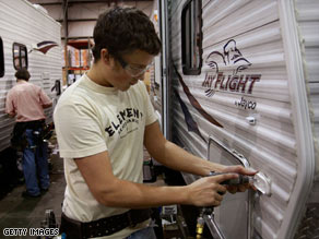 Workers at the Jayco plant in Elkhart County in Indiana put together a travel trailer in February.