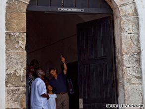 Obama points to the Door of No Return, which would shut before Africans were put on slave ships.