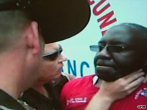 This is an image from a video that captured an Oklahoma trooper's scuffle with a paramedic in May.