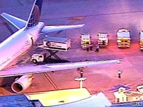 The diverted airliner sits on the tarmac at Miami International Airport.