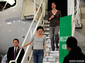 Freed journalist Euna Lee is followed by Laura Ling off their plane Wednesday in California.