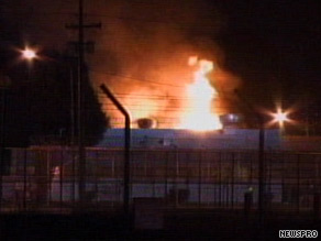 Flames leap from a housing unit at a prison in Chino, California, on Saturday night.