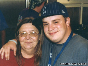 Loaves and Fishes executive director Rita Baldwin poses with her son, Scott Blain, who works at the kitchen.