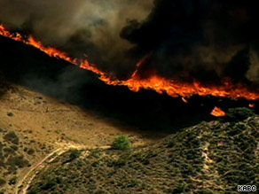 Strong wind, grass and light brush are fueling the Guiberson fire in southwest California.