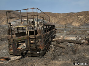 The Sheep Fire in Southern California has burned thousands of acres and left this bus a charred ruin.