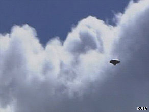 In a display of instant merchandising, shirts trumpeting the balloon's voyage sprouted up shortly after takeoff.