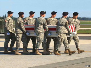 Mace's flag-draped coffin is carried by soldiers on the return to the United States.
