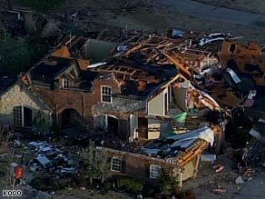 A large home stands in ruins after Tuesday night's tornadoes in Oklahoma.