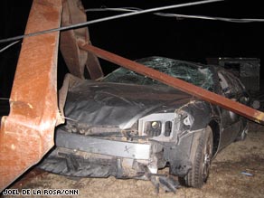 A car is severely damaged in the wake of a tornado Tuesday night in Lone Grove, Oklahoma.