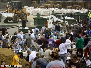 Volunteers load sandbags Tuesday at North Dakota State University in Fargo.