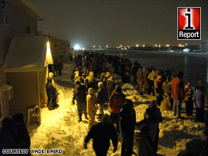 Volunteers wait early Thursday for sandbags in Fargo, North Dakota, in a photo from iReporter Wade Baird.