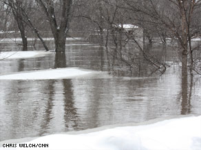 The water rises in Fargo, North Dakota, on Thursday, and the Red River could crest at 43 feet Saturday.