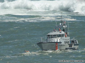 A U.S. Coast Guard rescue boat reaches a man swept out to sea Sunday at Acadia National Park in Maine.