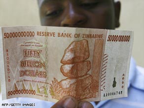 A boy examines the new $50 billion dollar note issued by Zimbabwe's central bank on January 13, 2009.