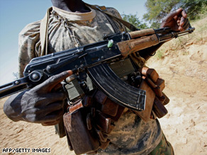 A member of the Justice and Equality Movement (JEM) stands guard near the Sudan-Chad border in 2007.