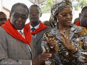 President Robert Mugabe and his wife, Grace, attend a cake-cutting ceremony for his birthday Saturday.