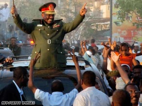 Sudan's President Omar Hassan al-Bashir waves to supporters in Khartoum.