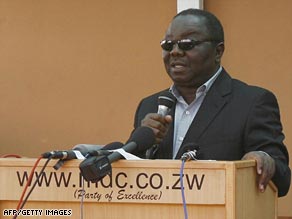 Morgan Tsvangirai addresses mourners Monday at his house in Harare soon after his return from Botswana.